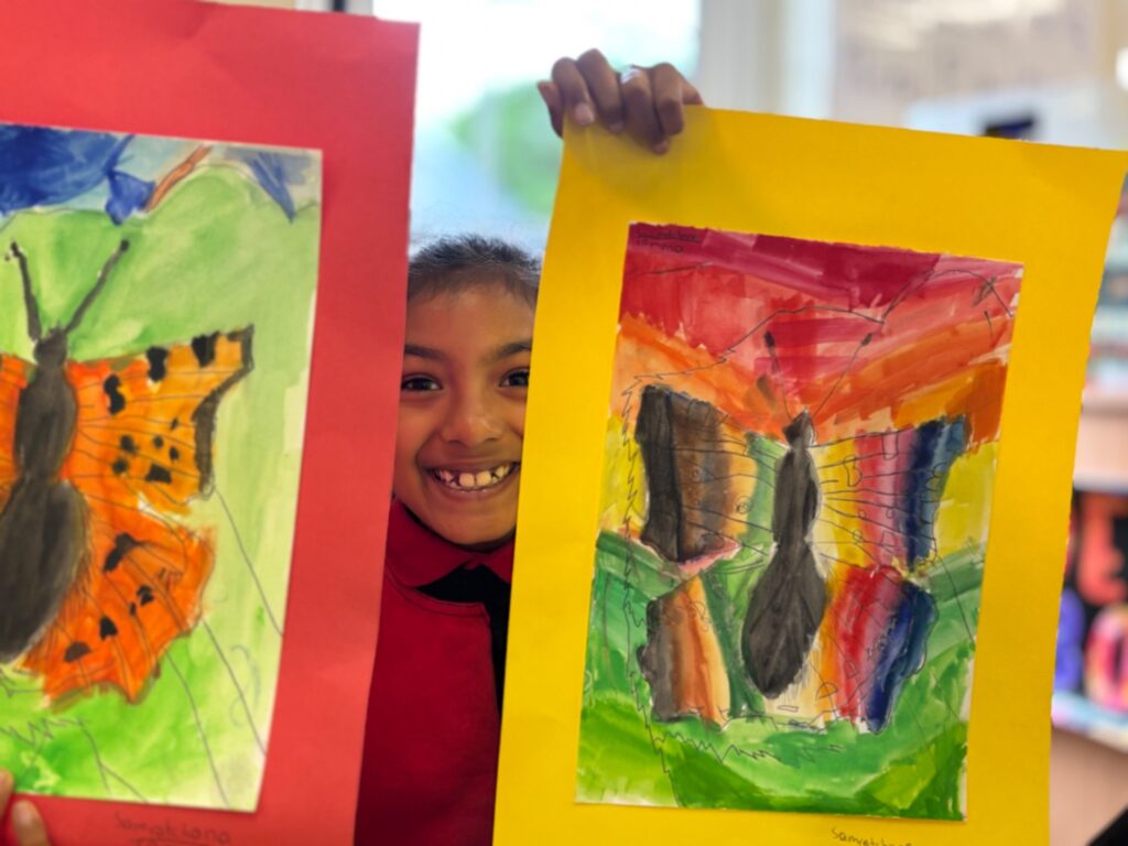 Samratchana with her two paintings