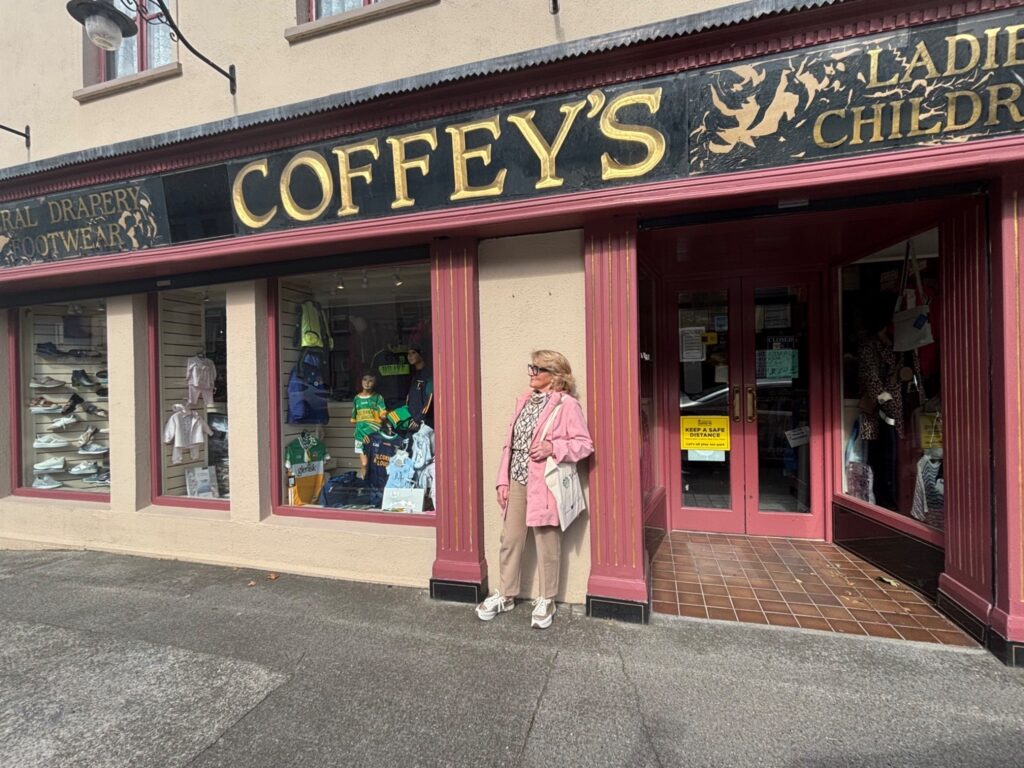 Photo of shop owner, Anne Coffey outside the draper shop on main street, Kilcormac where she has worked all her life and still runs in her seventies