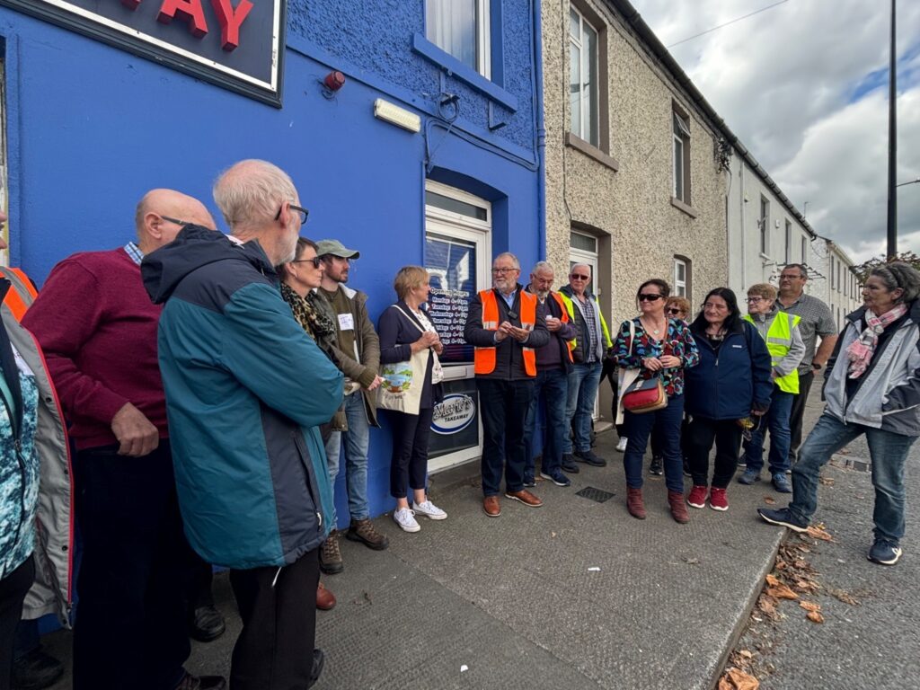 Local volunteers Sean Craven and Seamus Barron leading a guided heritage walking tour of Kilcormac with the local community group and with Monica Byrne, Tóchar, Laurence Fulham, Community Wetlands Forum, artist Tina Claffey participating.