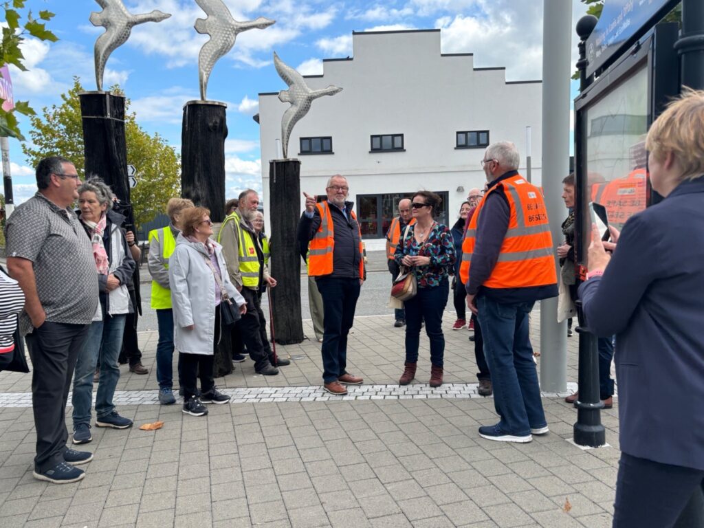 Photo of the walking heritage tour with the iconic flying swans sculpture and the newly restored Fiesta Hall, Kilcormac.