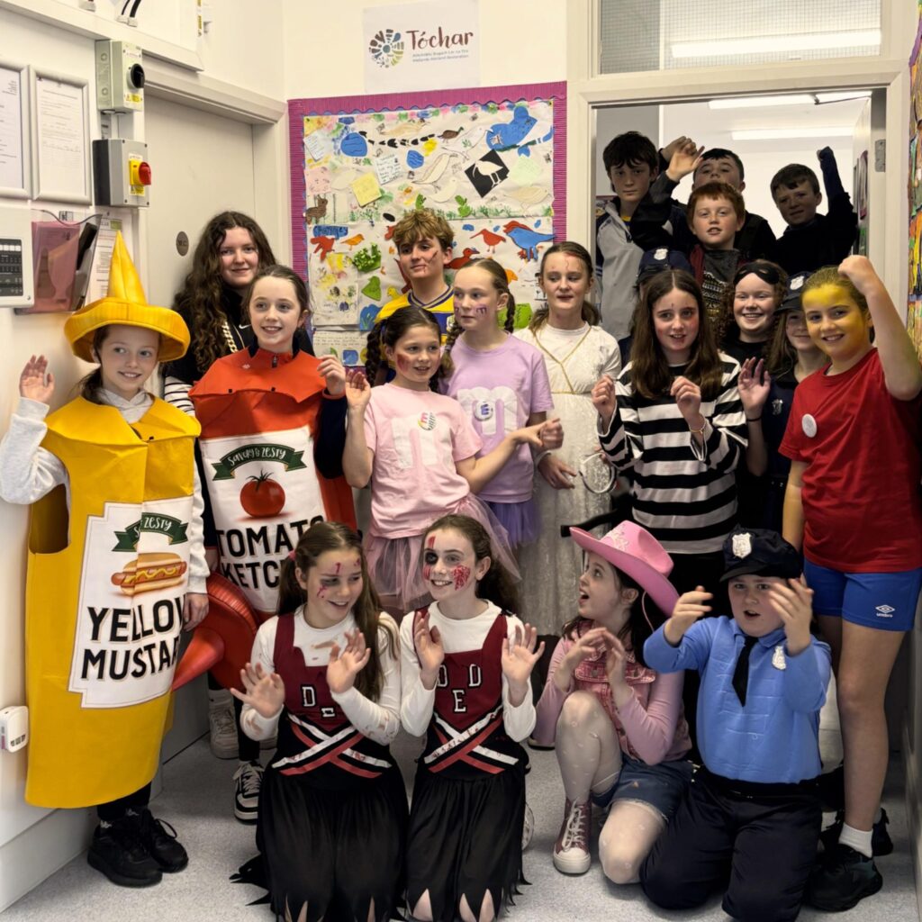 Photo of the Camcloon NS children celebrating Halloween and the creation of their artistic bog collage with Tóchar Stories and the Ballydangan Bog Red Grouse Project