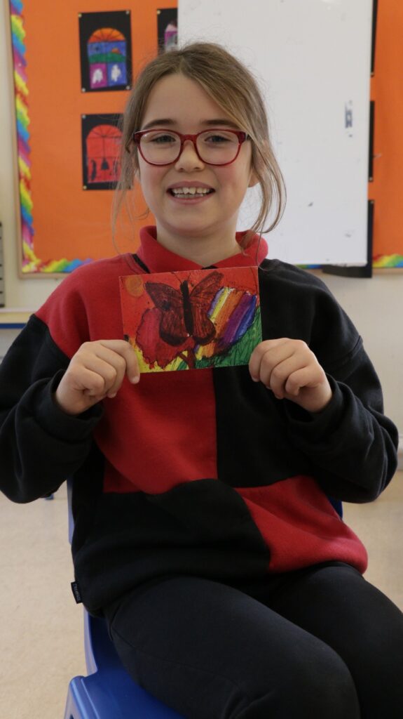 Photograph of Zofia and her Speckled Wood postcard