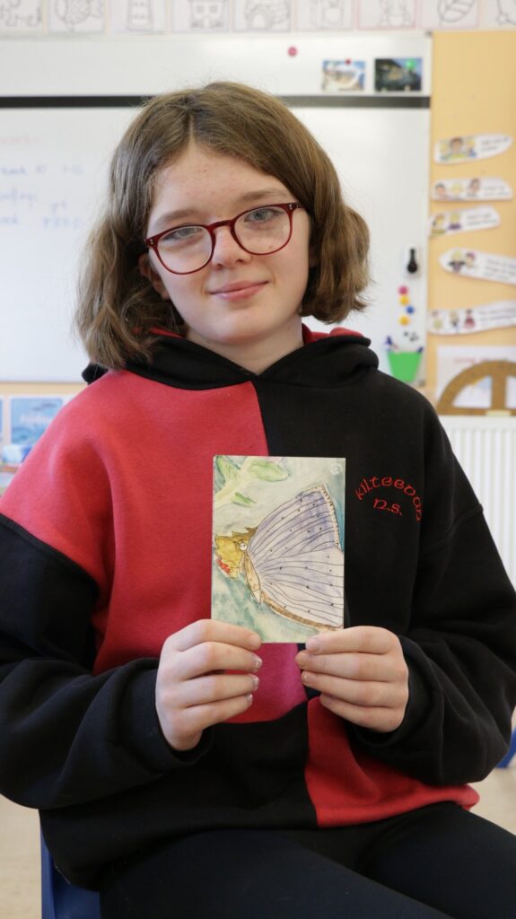 Photograph of Ruth with her Holly Blue postcard