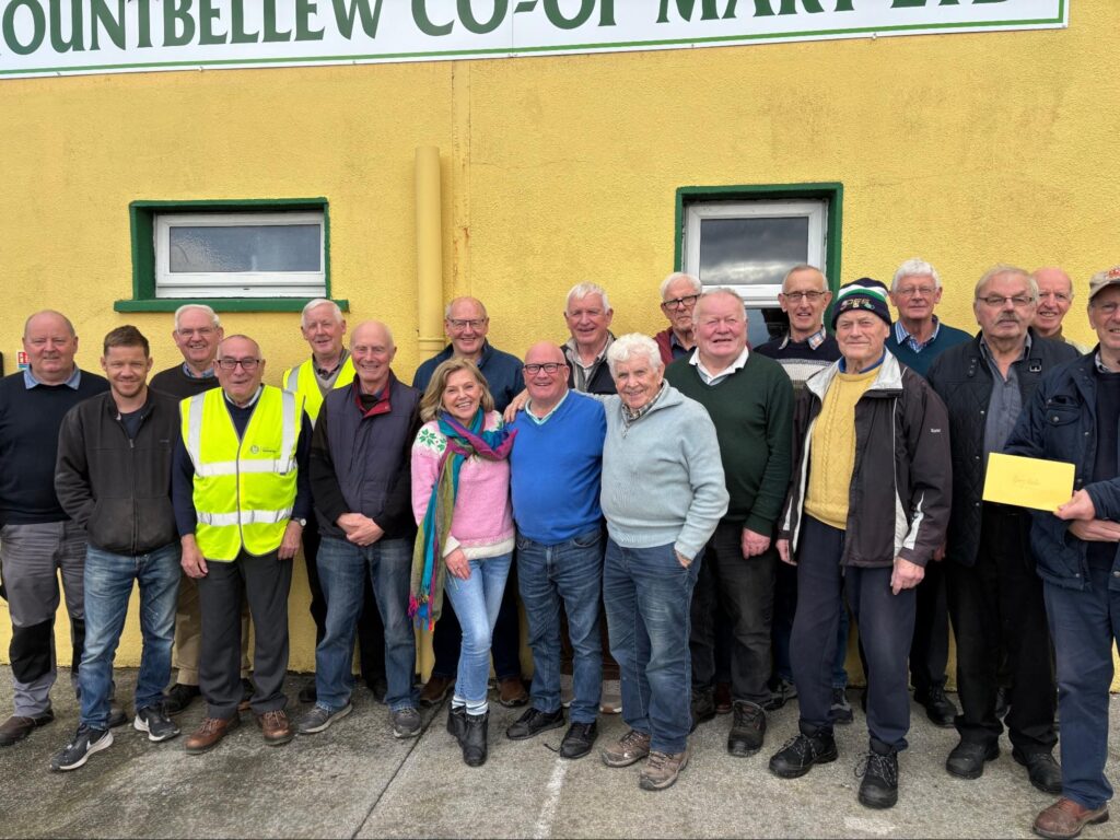 Photograph of Photo: Mountbellew Men’s Shed at the Co-op Mart, where the men meet twice a week, with Helen Shaw, Tóchar Stories