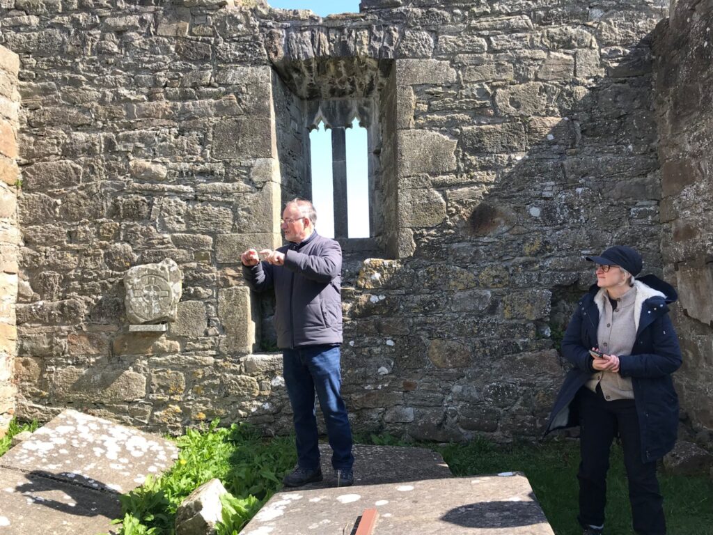 Photograph of local historian and community volunteer leader Seamus Corcoran at the monastic site with Dr Kate Flood, Community Wetlands Forum 
