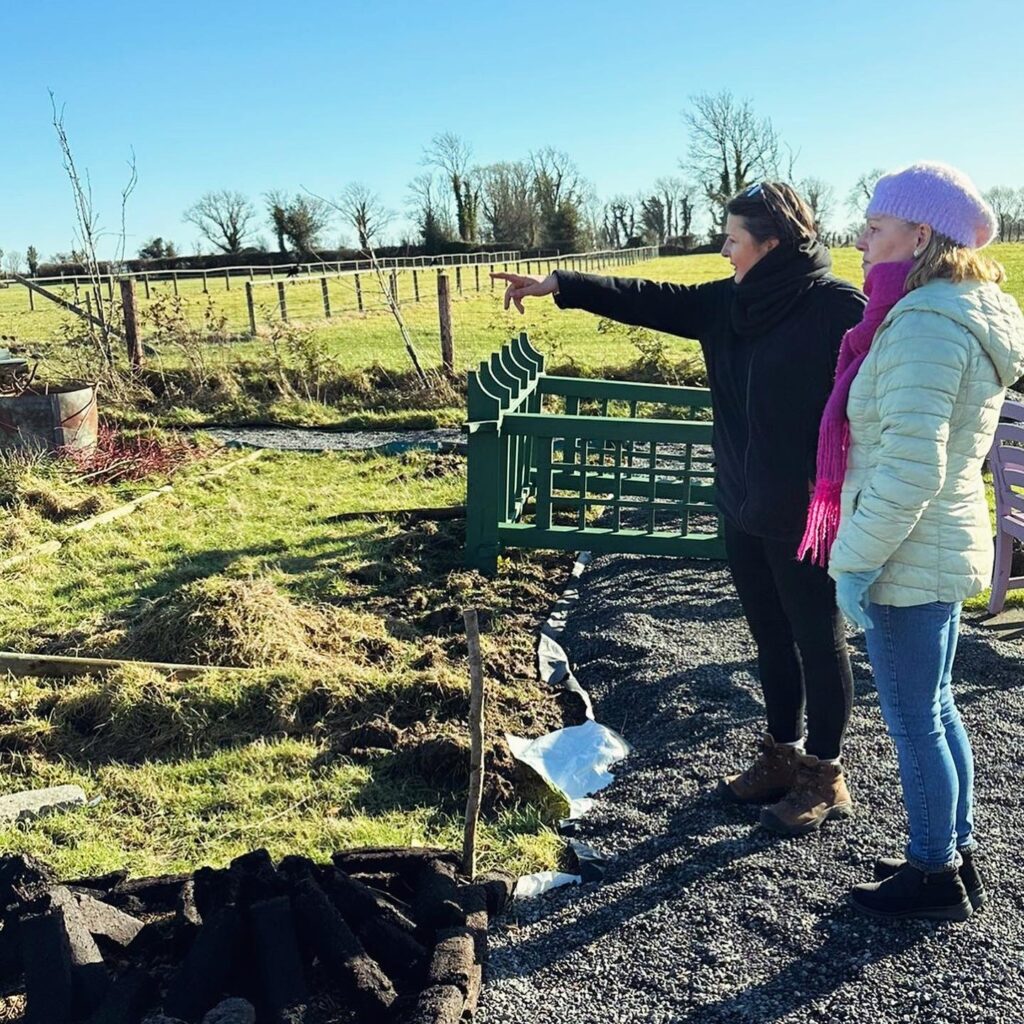 Photograph of Marie Gilmore and Tóchar Stories Helen Shaw at Galway’s Living Bog Interpretative Centre where they show visitors the history of turf cutting at the bog and have a small community garden (credit Kate Flood)