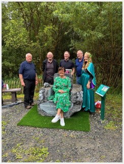 Photograph of Eileen Fahey with Kilteevan Tidy Towns members and the artist, Mark Feeley (Photo Eileen Fahey)