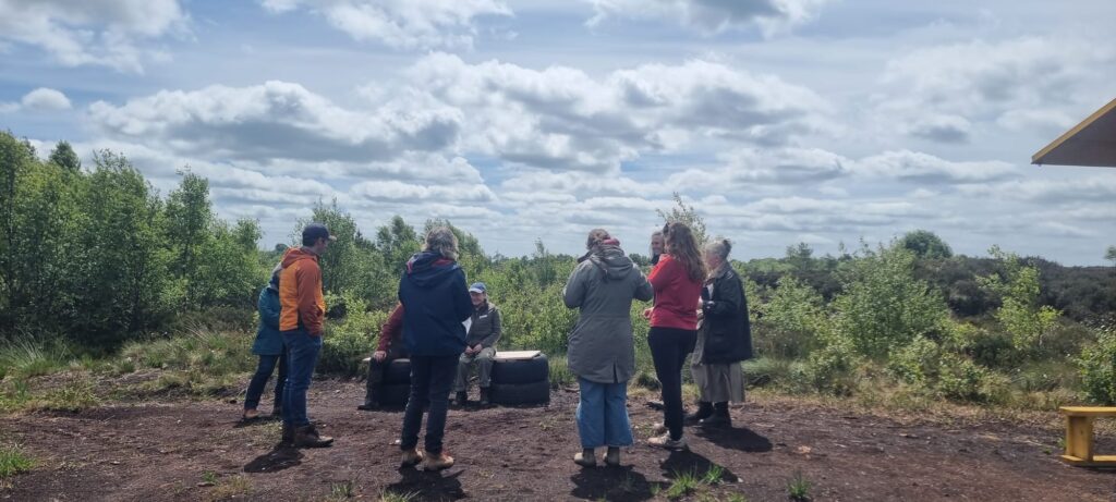 group of people standing in field