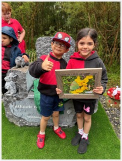 Photograph of two Kilteevan National School children on the fairy loop with the new wishing chair (Photo Susan O’Connor)
