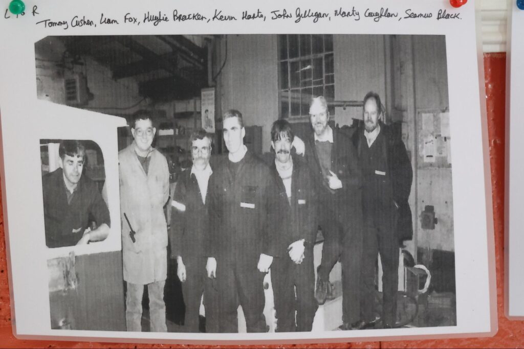 An old black and white photograph of some of the Bord na Móna workers