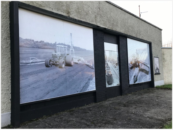 Large historical photographs of bog machinery on Cloontuskert