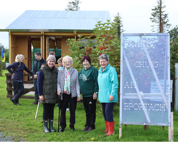 Group of women standing and smiling in front of Bog Bothy